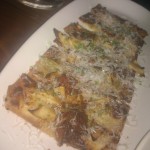 Grilled Pizzetta w/maytag bleu cheese, apple, double smoked bacon, truffle honey
